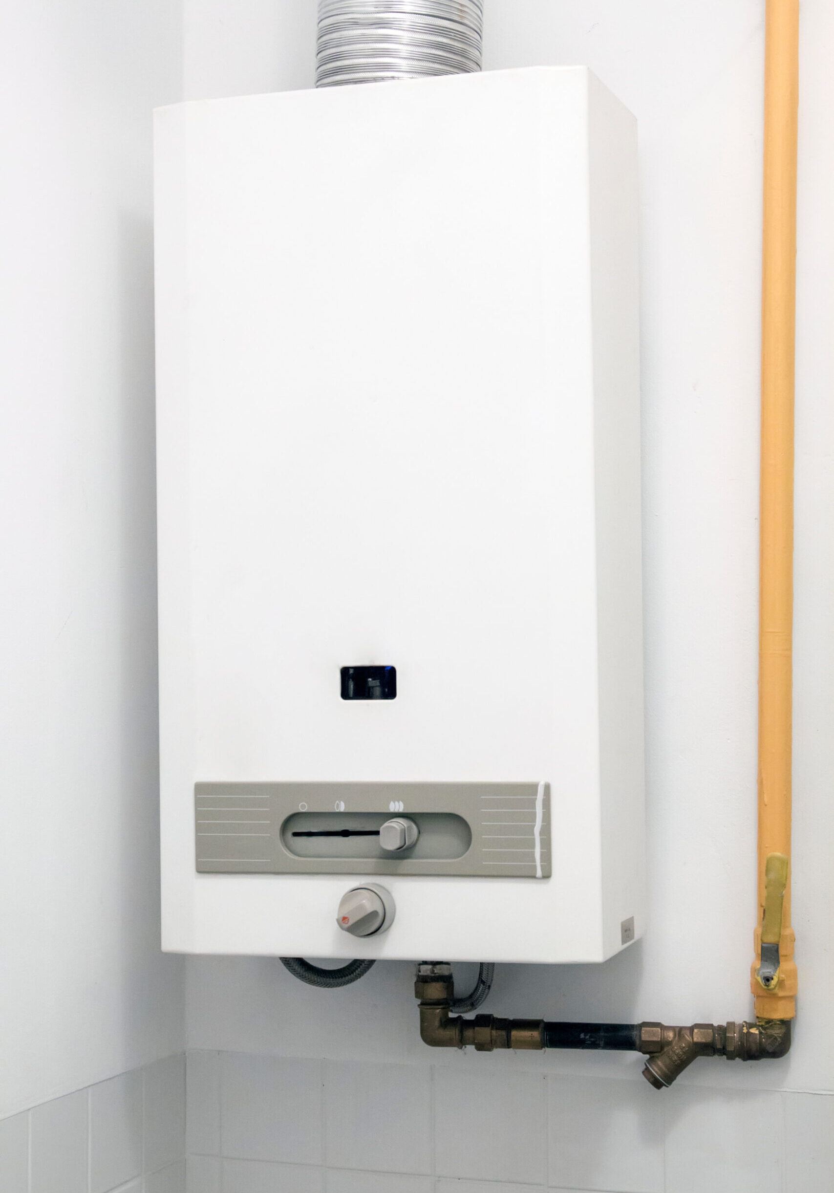 gas boiler water heater hanging on the wall in the bathroom